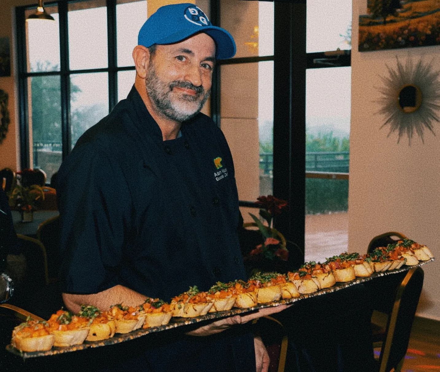 Chef Adam Mauro with food during the grand opening of The Venue Clermont